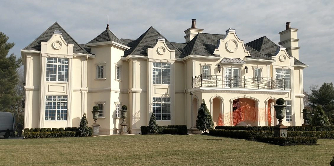 Cream-colored mansion with elegant stucco in Franklin Lakes, NJ